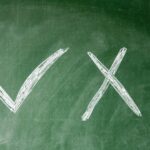 green chalkboars with a large X and checkmark - 4 Misconceptions About Mediation in Divorce