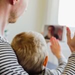 Faceless man and child talking to a woman on a tablet - long-distance co-parenting - Kelly D. Jordan Family Law.