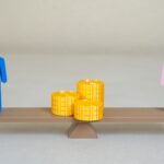 Coins in the middle of a seesaw with a male and female figure on either end - when is spousal support denied - Kelly Jordan Family Law.